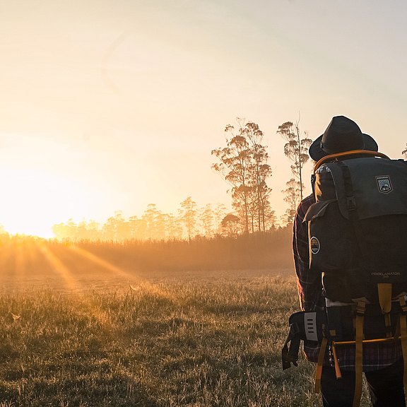 man-in-black-backpack-during-golden-hour-1230302.jpg